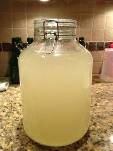 a glass jar filled with liquid sitting on top of a counter