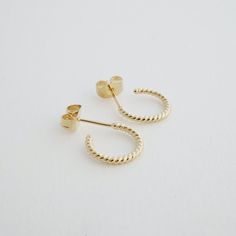 A pair of petite, twisted rope hoops. The post and butterfly closure allows for easy on and off. Gorgeous alone or layered alongside your favorite earrings. These measure 12mm. Our materials make for an amazing, high quality, seamless, jewelry piece with longevity. Our earrings are plated with 18k gold, 18k rose gold, or rhodium and finished with a protective coating. A little secret we'll keep between us: it looks way more than it costs. Coconut Wax Candles, Womens Watches Luxury, Link Earrings, Between Us, Rope Design, Delicate Jewelry, Timeless Accessories, Accessories Jewelry Earrings, Silver Rose Gold