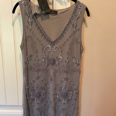 New With Tags. No Flaws Purchased From Overstock, But Never Worn. Size 10, But Seems To Run Small In My Opinion. Silver Embellished Sleeveless Sequin Dress, Silver Sleeveless Embellished Sequin Dress, Rave Dress, Gray Lace Dress, Emerald Bridesmaid Dresses, Embroidered Tunic Dress, Sleeveless Knit Dress, White Denim Skirt, Dark Blue Dress