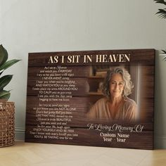 a wooden plaque with the words as i sit in heaven and an image of a woman's face