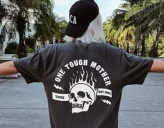 "✦ 🇺🇸SENT TO PRODUCTION AND PRINTED IN THE US🇺🇸 ✦ The perfect One Tough Mother Graphic TShirt is yours!  ✦ QUICK FACTS ✦ Comfort Colors® C1717 T-Shirt is 100% ringspun cotton (ringspun=comfort) Preshrunk, soft washed, garment-dyed fabric Twill-taped back neck and shoulders ✦ SIZING TIPS ✦ All our garments are UNISEX.  FOR AN OVERSIZED LOOK, SIZE UP 2-3 SIZES For a Relaxed Fit order your Usual Size For a Snug Fit order 1 Size down If you're unsure: Lay your favorite fitting T-Shirt flat and *measure armpit to armpit (1\" under armpit) for width *measure from point where neck seam meets shoulder all the way to bottom for length & compare with measurements in Size Chart provided in each listing *Please note, Size Chart Measurements are to be used as guidelines and measurements may vary wi Edgy Mom Style, Mom Shirts Funny, Cool Mom Shirts, Rock Skeleton, Shirt Outfit Ideas, It Shirt, Trendy Mom, Cool Mom, Skeleton Shirt