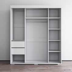 an empty white closet with shelves and drawers