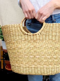 100% natural handwoven straw tote with bamboo handles. Handwoven in India with all-natural and plant-based materials with zero machinery. This sturdy large tote can be used as a weekender bag, a farmers market or grocery tote, or a beach bag. Large enough to fit it all and withstand daily multipurpose use. Grocery Tote, Straw Tote, Bamboo Handles, Carry All Bag, Beach Tote, Wicker Laundry Basket, Large Tote, Weekender Bag, Farmers Market