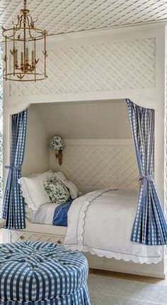 a bedroom with blue and white decor on the walls