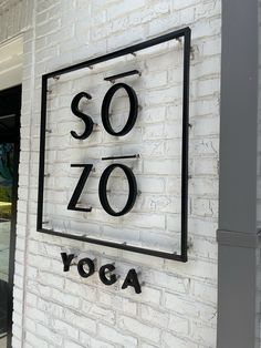 the sign on the wall says sozo yoga