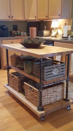 a kitchen island with baskets on it in the middle of a wooden flooring area