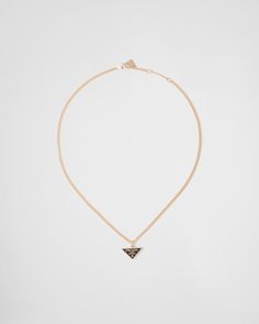 750 Yellow Gold (18 kt) Triangle pendant Lobster claw clasp Length 45 cm (17.71 inches) adjustable to 43 cm (16.92 inches) and 41 cm (16.14 inches) Made in Italy Each step of Prada's responsible gold and diamond production chain is verified and traceable thanks to Aura Blockchain technology. Triangle Pendant, White Necklace, Fine Jewelry Collection, Blockchain Technology, Gold Pendant Necklace, Blockchain, Gold Pendant, Geometric Shapes