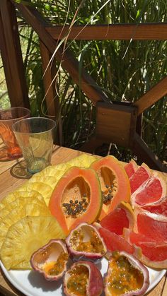 grapefruit, melon and orange slices on a plate with watermelon wedges