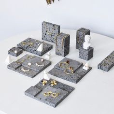 several pieces of jewelry are arranged on a table