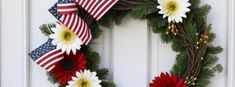 a wreath with red, white and blue flowers