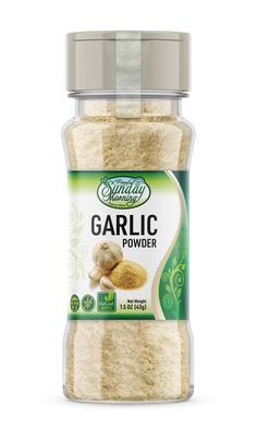 garlic powder in a glass jar on a white background