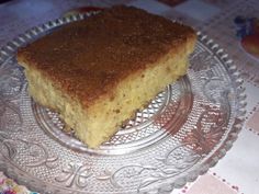 a piece of cake sitting on top of a glass plate