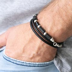 This handcrafted black leather bracelet features raw black tourmaline stones and oxidized sterling silver accents for a rugged yet sophisticated look. The bracelet is available in two styles: plain or braided leather, allowing you to choose the perfect fit for your style. The natural leather and raw gemstones give it a unique, artisanal feel, while the sterling silver clasp ensures secure wear. Ideal for everyday use or as a thoughtful gift. Perfect for men who appreciate quality craftsmanship a Raw Black Tourmaline, Black Tourmaline Stone, Elegant Wear, Mens Bracelets, Black Leather Bracelet, Oxidized Silver, Raw Gemstones, Oxidized Sterling Silver, Black Tourmaline