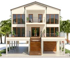 a three story house with two balconies on the second floor