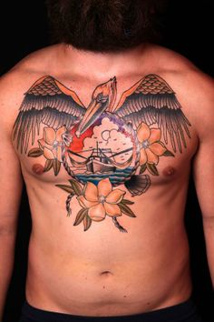 an image of a man with tattoos on his stomach and chest, showing the tattoo design