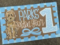 a sign with a dog on it that says park's golden year 1, and the number one