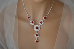 "Bridal Jewellery Set, Burgundy Jewelry Set, Wedding Jewelry Set, Bridal Earrings, Bridal Necklace, Burgundy Swarovski crystals, Box Set, Personalized Gift Materials used in the manufacture of jewelry: rhinestones, burgundy Swarovski crystals, silver plated, jewelry alloy. The length of the necklace is regulated by a chain and is 12.6-17.3\" (32-44 cm). If the length of the jewelry is not suitable for you, I can increase or decrease it to the size you need. You just need to specify the size you Round Rhinestone Bridal Necklace, Rhinestone Bridal Necklace For Wedding, Round Bridal Necklace With Rhinestones, Burgundy Jewelry, Bridal Jewellery Set, Blue Jewelry Set, Pink Jewelry Set, Silver Tiara, Pearl Tiara