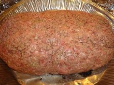 a large meatloaf sitting on top of a metal pan