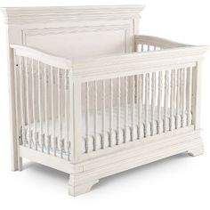 a white baby crib on a white background