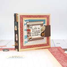 a card with the words, wild west on it and some other things around it