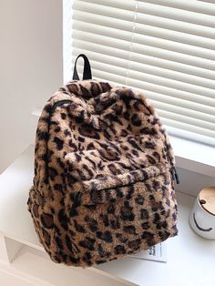 Qteee - Allover Leopard Pattern Fluffy Backpack - Women Backpacks Product Description Color Brown Quantity 1 piece Material Faux Fur Size Chart INCH CM Size Bag Width Bag Height Bag Length Strap Length one-size 4.3 14.6 10.6 43.3 Size Bag Width Bag Height Bag Length Strap Length one-size 11 37 27 110 Similar Products Fluffy Backpack, Fuzzy Bag, Leopard Print Bag, Cute Backpack, Functional Backpack, School Bookbags, Shoulder Bags For School, Mini Mochila, Plush Backpack