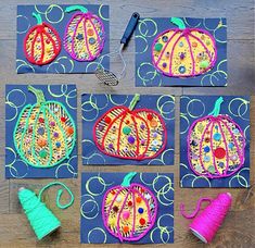 four pictures of pumpkins made out of yarn and scissors on a wooden table top