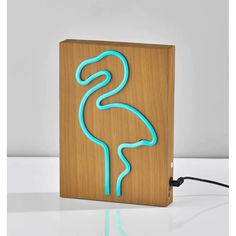 a wooden box with a neon light in the shape of a flamingo