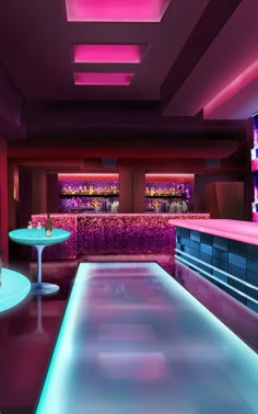 the interior of a modern bar with purple lighting