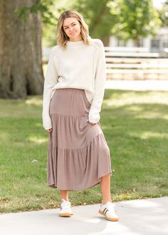 The Nellie Tiered Maxi Skirt is a modest and elevated skirt you will love for church or everyday! This modest maxi skirt was designed to make movement comfortable and effortless all while looking put together and feeling beautiful. It has tiers with an elastic waist for a flattering and modest fit, and it is made in the USA! Just add your favorite bodysuit, denim jacket, and mules for an effortless look! Style | Maxi Color | Mocha SIZING TIPS Fit | Semi-Fitted Stretch | Stretchy Model | True to Looking Put Together, Modest Maxi, Modest Fits, Tiered Maxi Skirt, Store Fronts, How To Feel Beautiful, Mocha, Work Outfit, Maxi Skirt