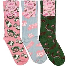 three pairs of socks with different designs on them