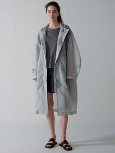 This is a trendy and modern rain coat by FACADE PATTERN that is made out of high quality and sturdy material. With distinctive mood of the design and modern feminine look, you can style it for your trendy daily outfit.- Water resistant processed fabric- Wind break functional- Relaxed oversized silhouette- String and stopper on the hoodie Facade Pattern, Raincoat Outfit, Bermuda Pants, Wind Break, Modern Feminine, Oversize Women, Summer Essential, Sleeveless Dress Summer