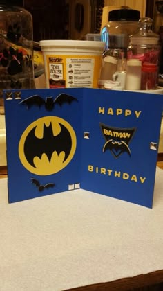 a batman birthday card sitting on top of a table