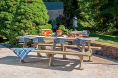 a picnic table set up outside in the sun