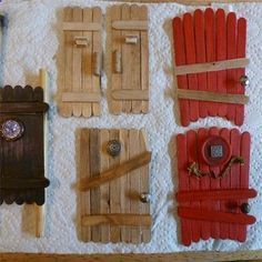 several pieces of wood are laid out on a towel with buttons and magnets attached to them