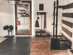 the inside of a home gym with equipment