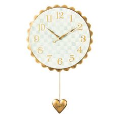 a clock with a heart hanging from it's side on a white background,