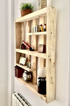 a wooden shelf that has various items on top of it, along with a radiator