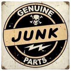 an old metal sign with the words junk parts in black and white, says genuine junk parts