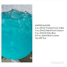 a blue drink in a glass with ice and water on the rim, labeled winter classer