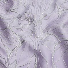 an image of a close up view of a flower on a purple background with silver thread