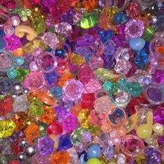 many different colored beads are scattered together