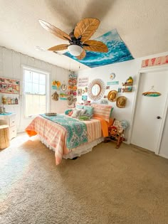 a bed room with a neatly made bed and a ceiling fan