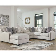 a living room filled with furniture and a rug