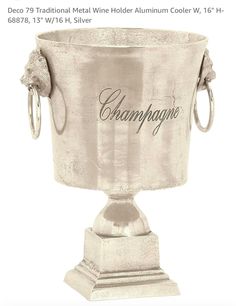 an antique silver cup with the word champagne on it's side and two handles