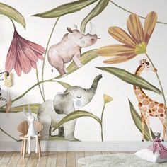 an elephant, giraffe and zebra mural in a child's room