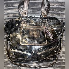 This Bag Is A Limited Poppy Coach Edition. It Is Absolutely Stunning And I Carried It Once. It’s Basically Brand New And Is Not Available In Stores Now. Inside Is Lavender And Outside Is Silver Sequins With Cute Keychain Like Accessories. Luxury Silver Bag With Removable Pouch, Party Shoulder Bag In Silver With Gunmetal Hardware, Silver Shoulder Bag With Gunmetal Hardware For Party, Silver Party Shoulder Bag With Gunmetal Hardware, Luxury Shoulder Bag With Silver Accents, Luxury Shoulder Bag With Silver Accents For Everyday Use, Luxury Coach Bag For Party, Luxury Coach Party Bag, Luxury Coach Party Bags