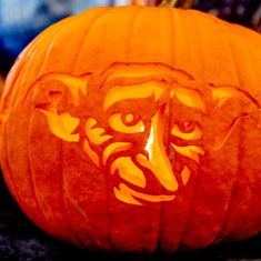 a carved pumpkin with an angry face on it