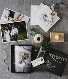 the wedding stationery is laid out on top of the table with photos and twine