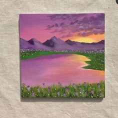 an acrylic painting of a lake with mountains in the background and grass on the ground