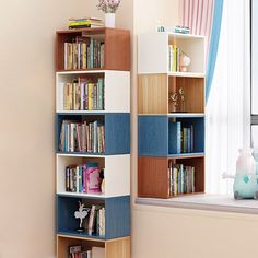 a bookshelf filled with lots of books next to a window in a room